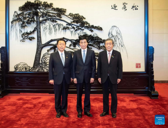 Chinese, Japanese ruling parties agree to maintain close ties.

